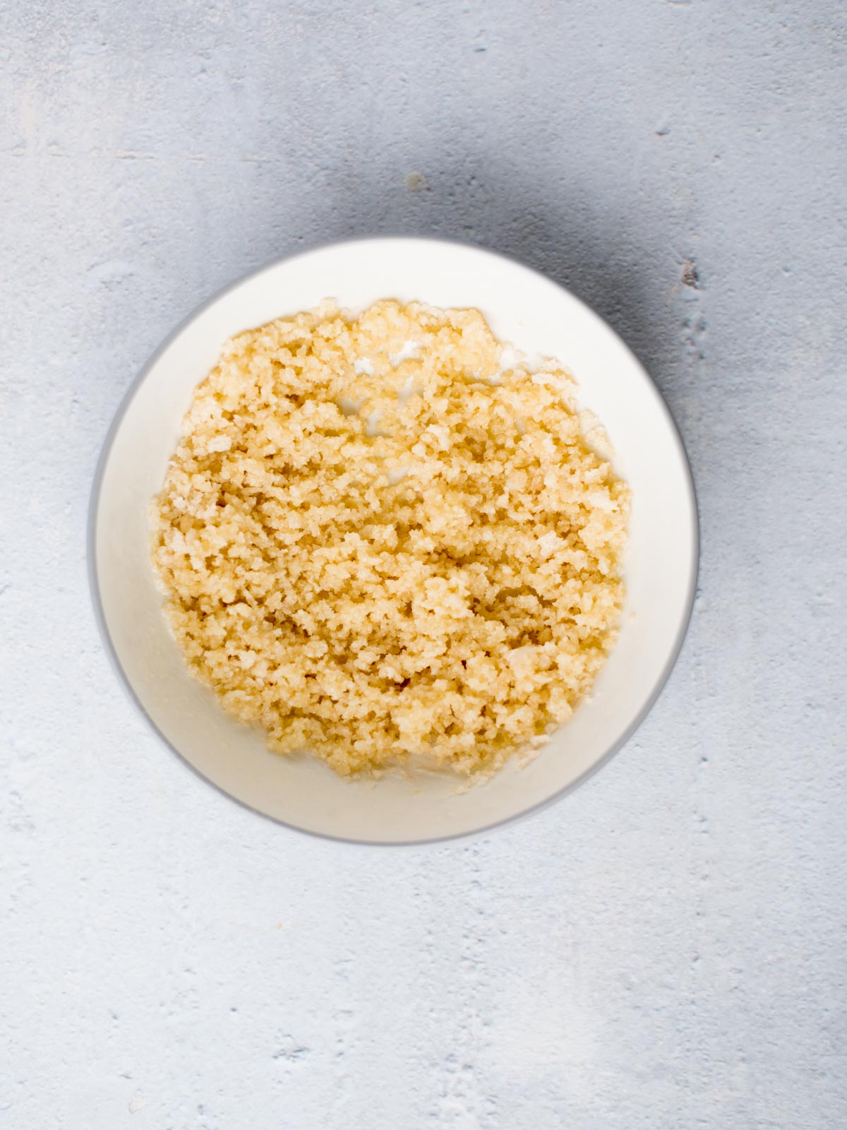 breadcrumbs mixed with butter in a bowl