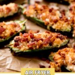 air fryer jalapeno poppers on a parchment paper sitting on top of a bread board with a text overlay that says "air fryer jalapeno poppers"