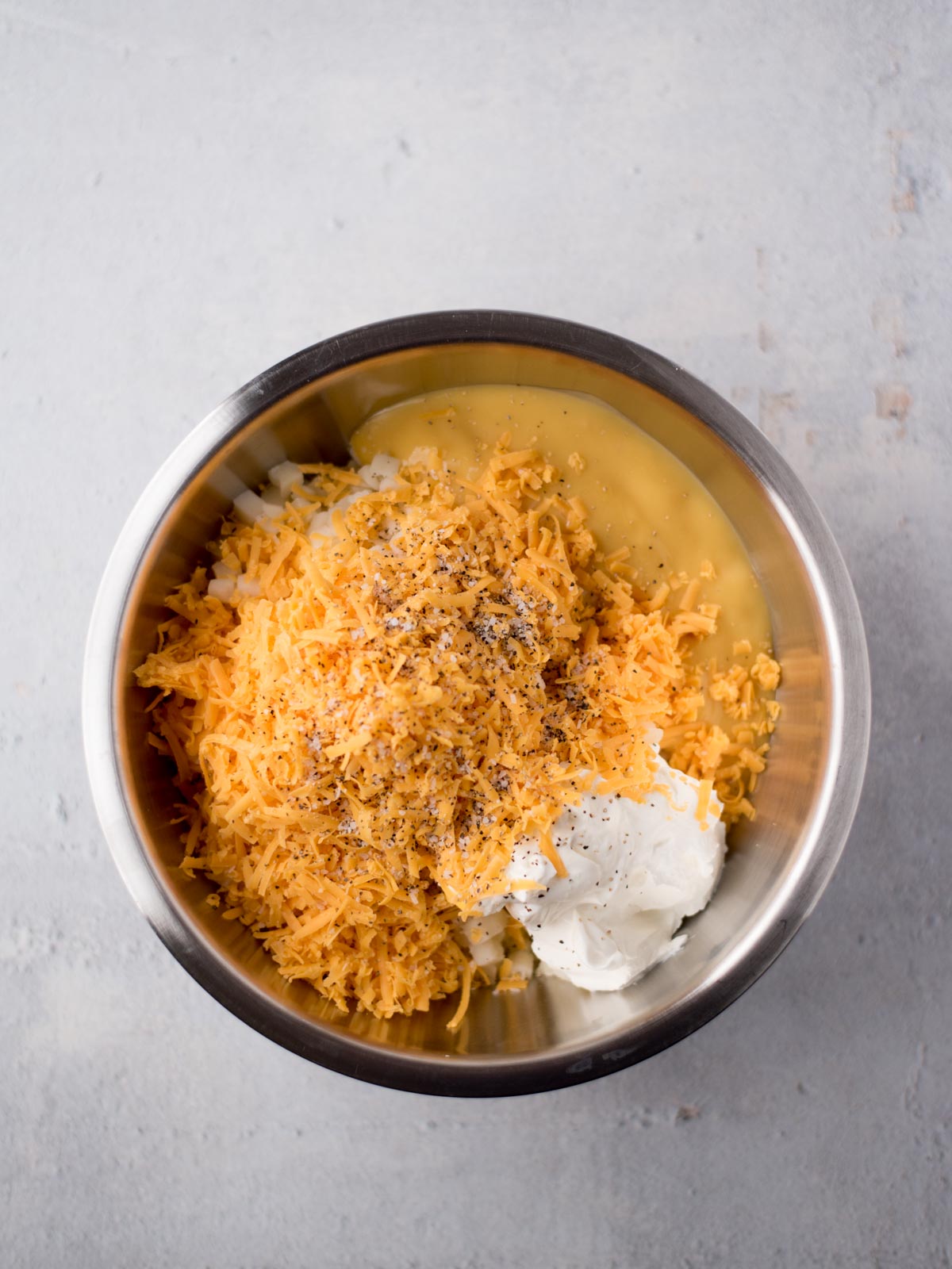funeral potatoes filling in a mixing bowl