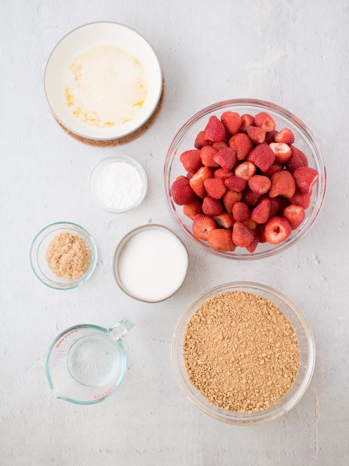 ingredients to make strawberry pie in a graham cracker crust