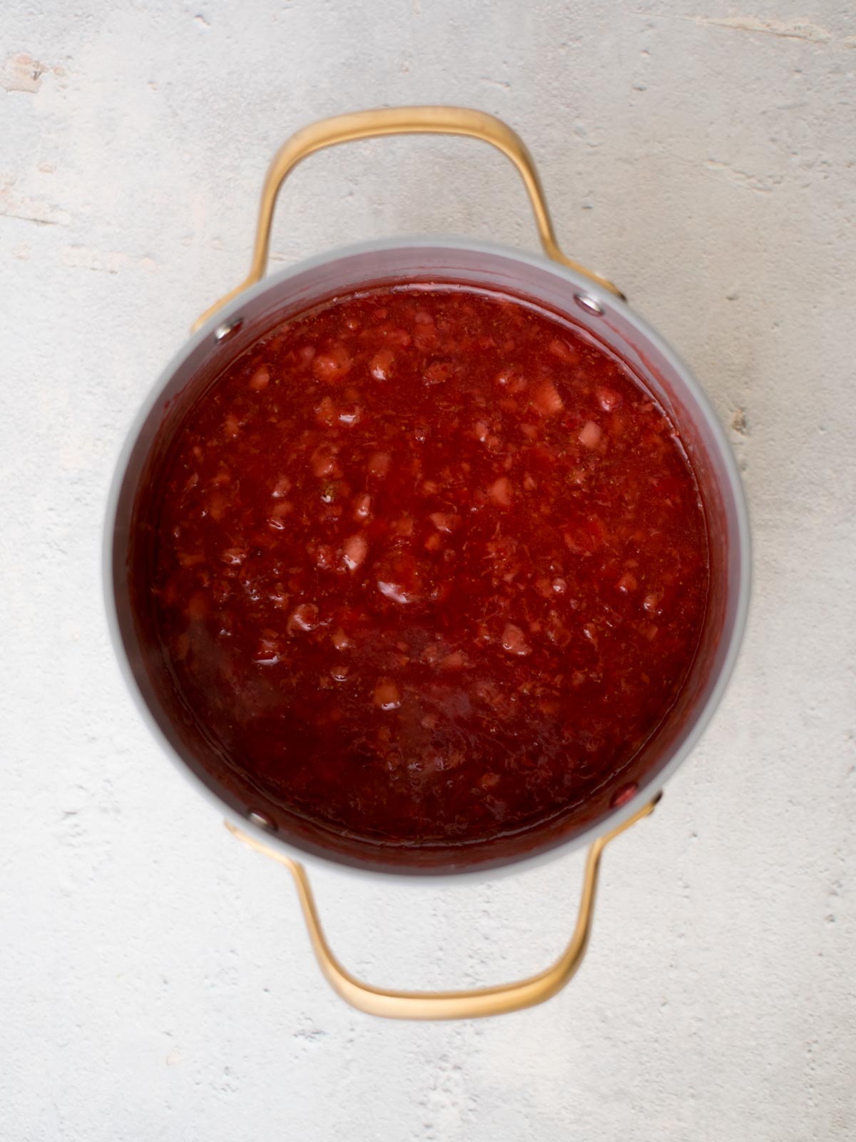 strawberry pie jam filling in a saucepan