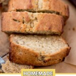 Close-up of sliced homemade banana bread on parchment paper. The Golden-brown crust and moist interior is visible. The text sweetlyspendid.com is at the top, and HOMEMADE BANANA BREAD is written at the bottom.