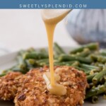A close-up of crispy almond chicken on a plate with green beans. Sauce is being poured over the chicken. The text Crispy Almond Chicken and sweetlysplendid.com is displayed at the top.