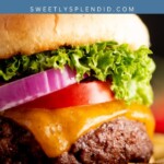 Close-up of a grilled burger with cheddar cheese, lettuce, tomato, red onion, and a bun. The text above reads grilled BURGERS and SWEETLYSPLENDID.COM. French fries are visible on the side.