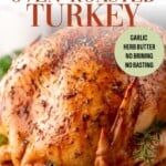 An oven roasted turkey with text reading The Best Oven Roasted Turkey and a circular badge stating Garlic Herb Butter, No Brining, No Basting.