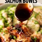 A spoon drizzling dark sauce over a salmon bowl with edamame and cucumbers, with the text Air Fryer Salmon Bowls at the top.